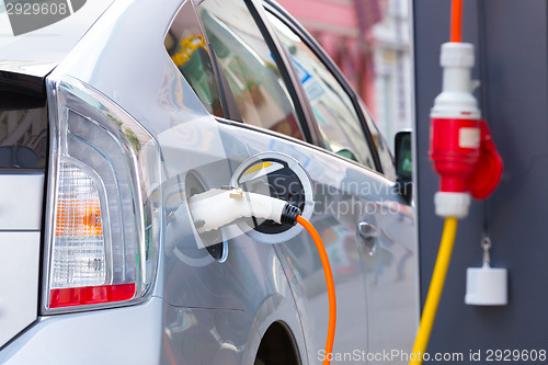 Image of Electric Car in Charging Station.