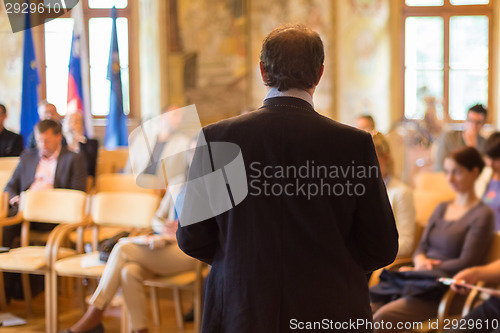 Image of Speaker at Business Conference and Presentation.