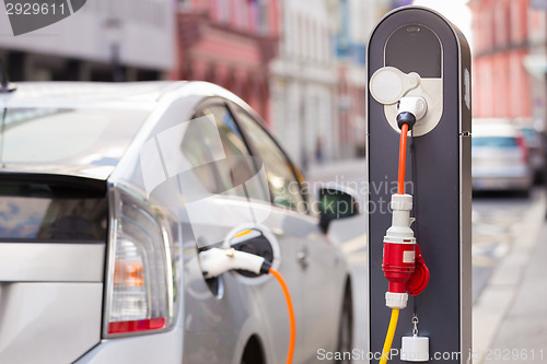 Image of Electric Car in Charging Station.