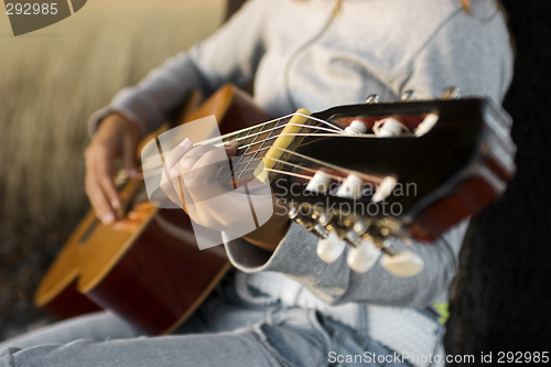 Image of Playing guitar