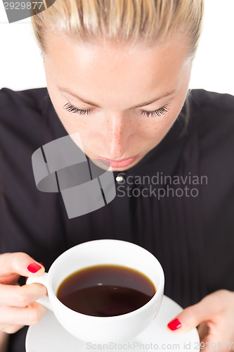 Image of Business woman with cup of coffee.