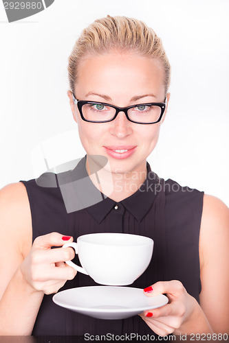 Image of Business woman with cup of coffee.