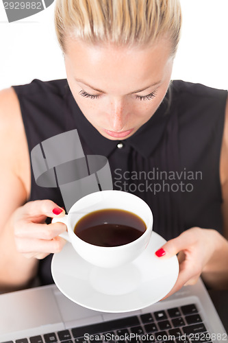 Image of Business woman with cup of coffee.