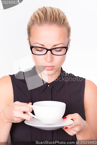 Image of Business woman with cup of coffee.