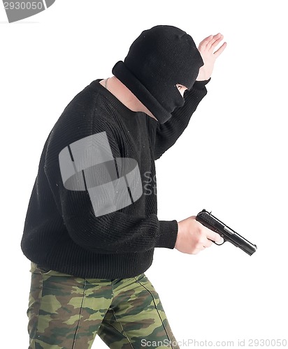 Image of Masked man with gun