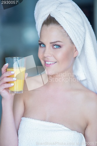 Image of Woman holding glass of juice