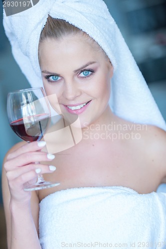 Image of Woman in White Bath Towel Holding Glass of Wine
