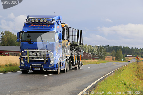 Image of Volvo FH13 Hauls Ponsse Forwarder on the Road