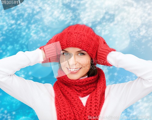 Image of smiling young woman in winter clothes