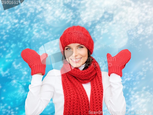 Image of smiling young woman in winter clothes