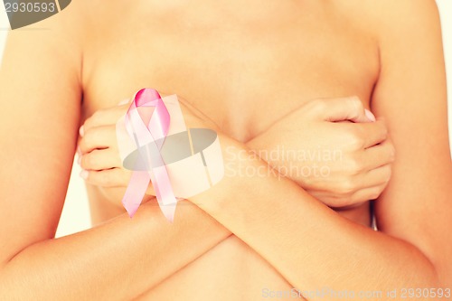 Image of naked woman with breast cancer awareness ribbon