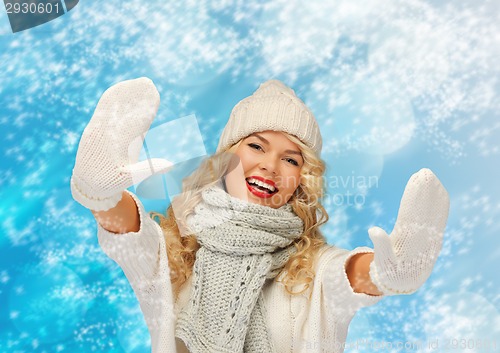 Image of smiling young woman in winter clothes