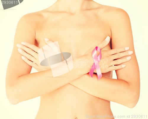 Image of naked woman with breast cancer awareness ribbon