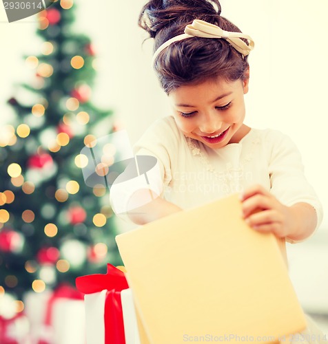 Image of happy child girl with gift box