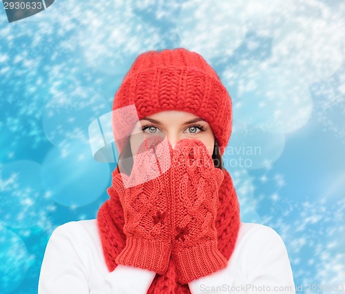 Image of smiling young woman in winter clothes