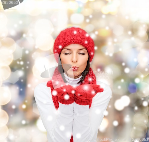 Image of smiling young woman in winter clothes