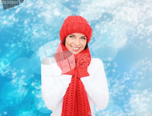 Image of smiling young woman in winter clothes