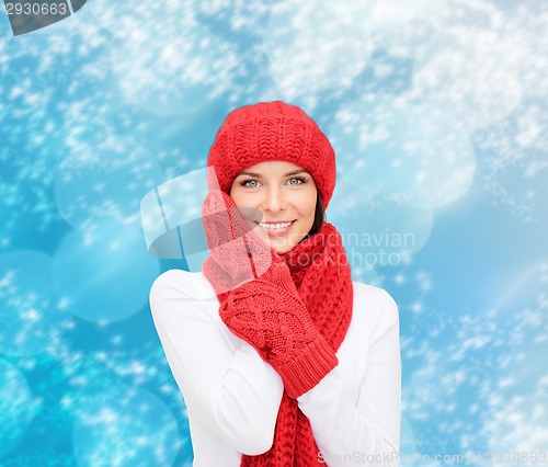 Image of smiling young woman in winter clothes