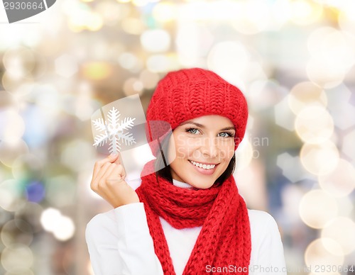 Image of smiling young woman in winter clothes