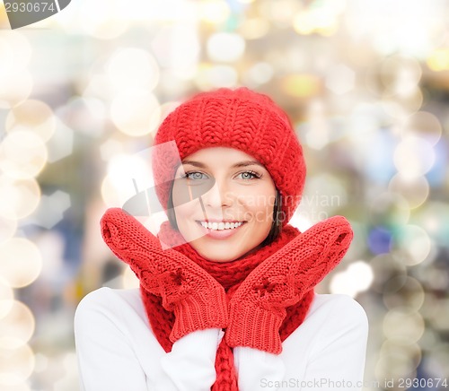 Image of smiling young woman in winter clothes