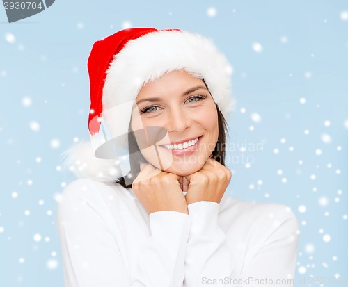 Image of smiling woman in santa helper hat