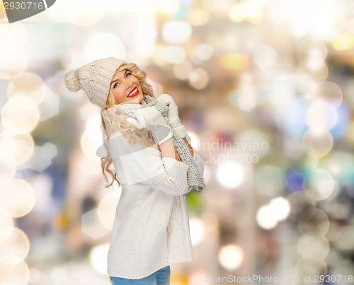 Image of smiling young woman in winter clothes