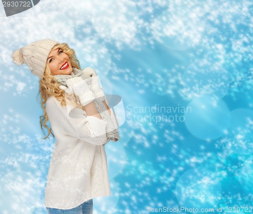 Image of smiling young woman in winter clothes