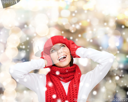 Image of smiling young woman in winter clothes