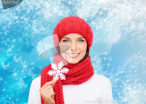 Image of smiling young woman in winter clothes