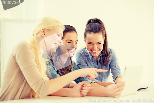 Image of smiling students with tablet pc computer at school