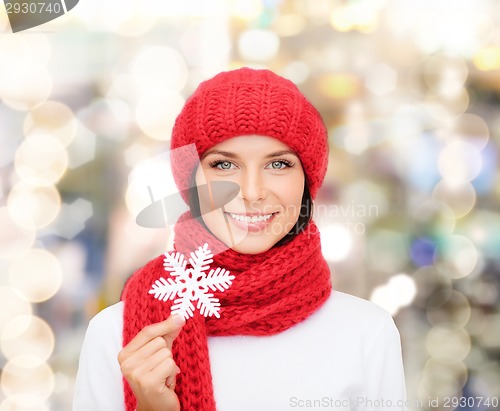 Image of smiling young woman in winter clothes