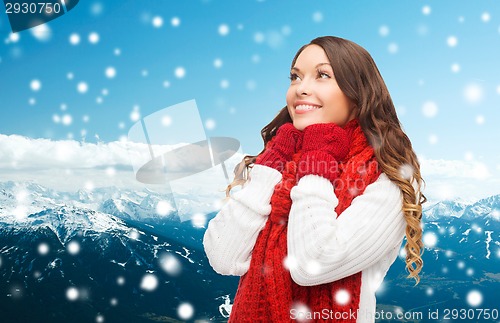 Image of smiling young woman in winter clothes