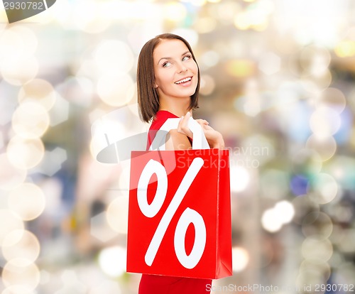 Image of woman in red dress with shopping bags