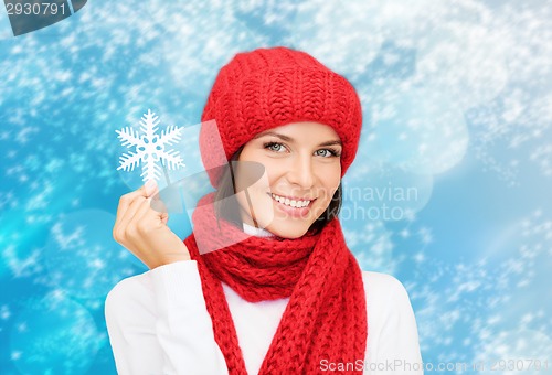 Image of smiling young woman in winter clothes