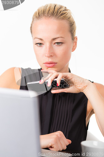 Image of Business woman in office.