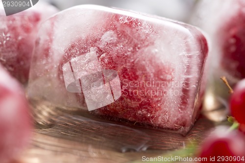 Image of Fresh berry fruits frozen in ice cubes
