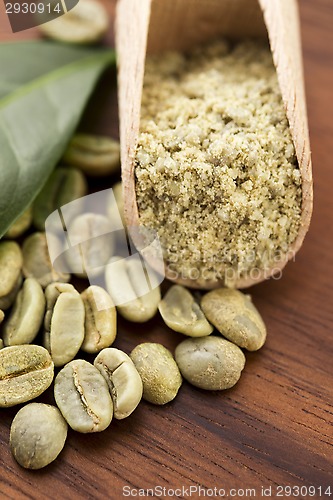 Image of Green coffee beans with leaf