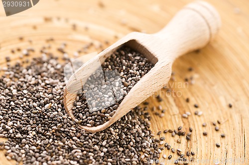 Image of Nutritious chia seeds on a wooden spoon