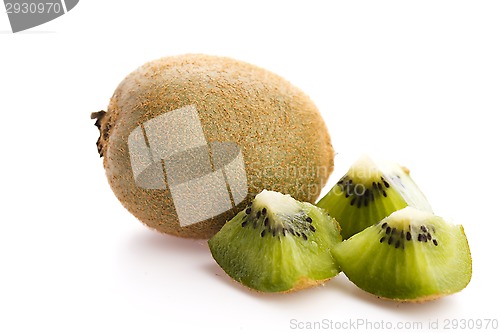 Image of Whole kiwi fruit and his sliced segments isolated on white backg