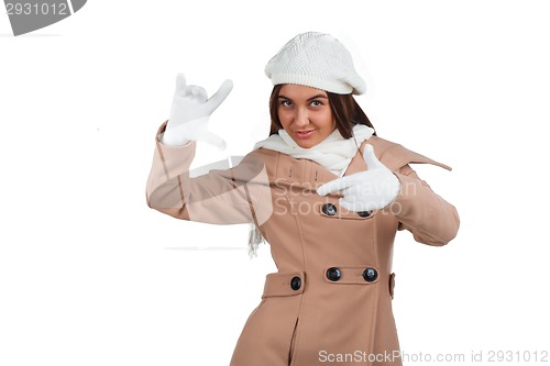 Image of Woman in outrwear, white scarf and hat