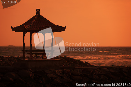 Image of Gazebo on the ocean shore at sunset. Indonesia, Bali