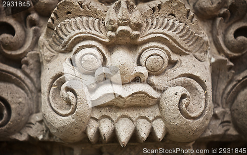 Image of Face of the ancient deities carved in stone. Indonesia, Bali