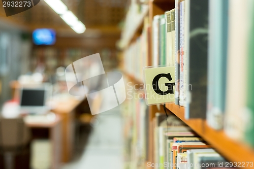 Image of Library bookshelf closeup with letter