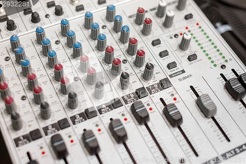 Image of Closeup photo of an audio mixer