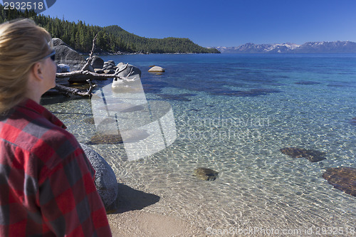 Image of Woman Looking Over Beautiful Shoreline of Lake Tahoe.