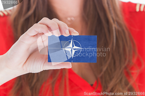 Image of Woman showing a business card