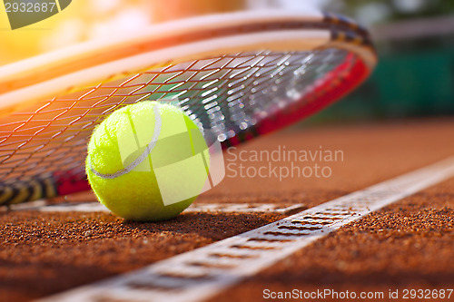 Image of 	tennis ball on a tennis court