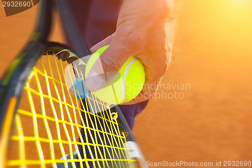 Image of 	tennis ball on a tennis court