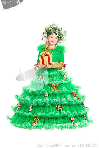 Image of Little girl in green christmas dress