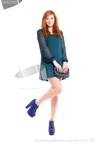 Image of Pretty young woman in turquoise dress